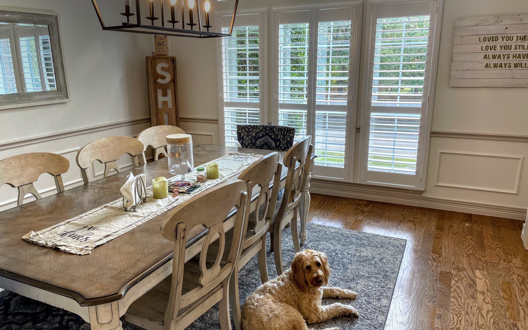 Custom plantation shutters across the windows of a Des Moines home by Love Is Blinds